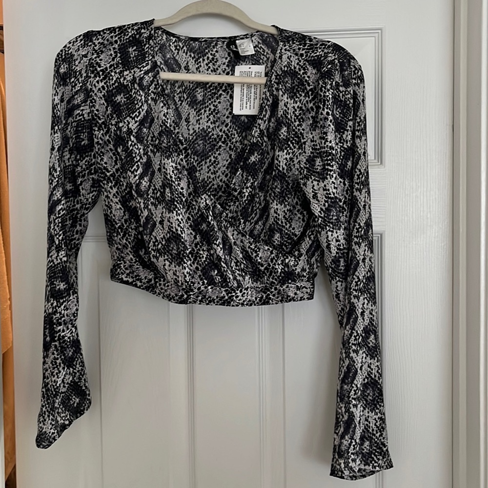 Brand new multi color waist length blouse